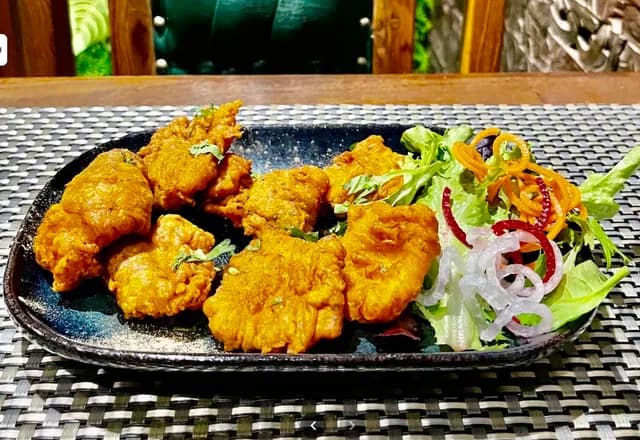 A restaurant's own photo of a chicken dish
